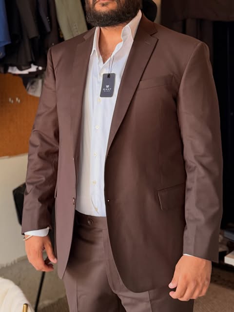 Brown custom blazer worn over a white shirt